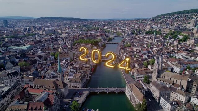 Aerial view of the city of Zürich, Switzerland with an illustration of the 2024 Visualization. The effect of glowing numbers in the middle of a modern city welcoming the new year.