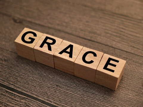Grace text, written on wooden block, balance in life