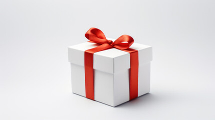 Obraz premium White gift box with red ribbon