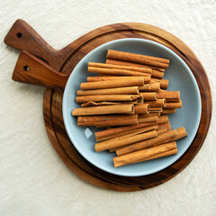 cinnamon sticks on a plate on the table