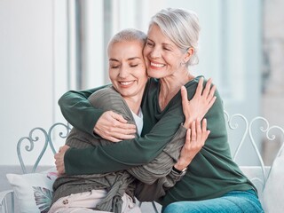 Smile, hugging and senior mother with woman in the living room for bonding, love and care at home....
