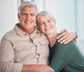 Senior couple, hug and portrait on couch with smile, care and bonding with love, retirement and home living room. Happy old man, elderly woman and embrace on lounge sofa, relax and pride in apartment