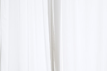 Obraz premium Elevate your space with luxurious white drapery, adding elegant touch to your home's interior. real photo