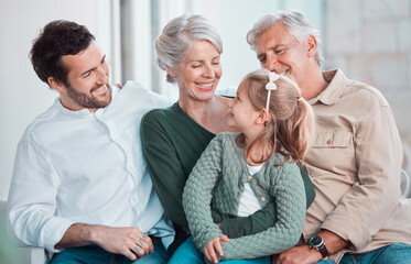 Grandparents, girl and happy with dad on sofa for hug, care or bonding with love in family home lounge. Elderly people, kid and father with smile, relax and conversation on living room couch in house