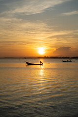 Local fishing boats catch fish early in the morning.