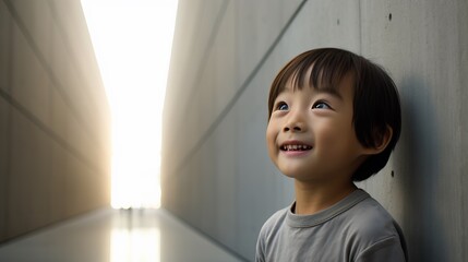 Little Boy Standing in Front of a Wall