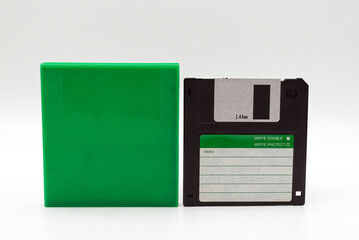 Floppy disk of 1.4 megabytes isolated on white background and plastic protective box
