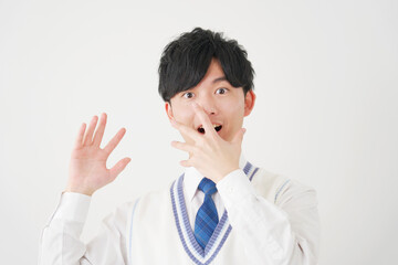 驚く男子高校生　白背景