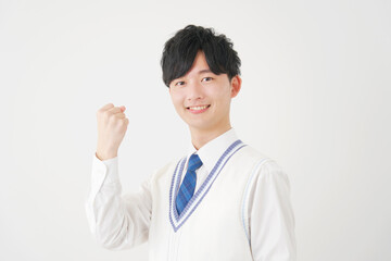 ガッツポーズをする男子高校生　白背景