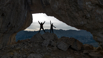 The joy of victory, happiness and success of two friends who discovered magnificent places