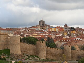 Fototapeta premium To the north of Madrid sits the rustic city of Ávila. Medieval walls surround the preserved 16th-century town.