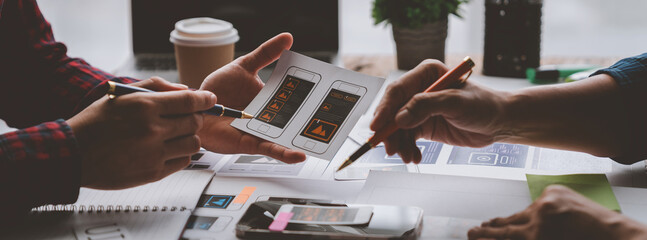 Creative business team in mobile software design project, brainstorming meeting, working together, internet technology in smartphone web part, teamwork concept, colleagues.