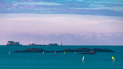 Seascape of the Fort de la Conchée in Saint-Malo. In the foreground, a windsurfing competition.
