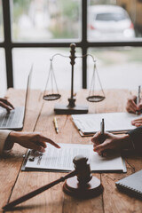 Lawyers, legal advisors, businessmen, investors brainstorm to clarify details of agreements,...