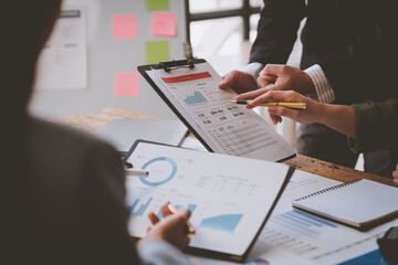 Business teams meet to discuss business, brainstorm ideas, analyze reports from growth reports, graphs, charts showing financial projects. Check investment results and profits of the company.