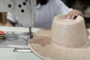 Sewing a traditional palm tree hat