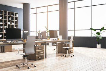 Bright coworking office interior with bookcases, panoramic windows and city view, furniture, equipment and computer monitors. 3D Rendering.