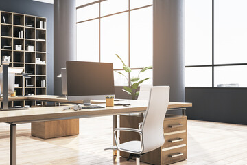 Clean coworking office interior with bookcases, panoramic windows and city view, furniture, equipment and computer monitors. 3D Rendering.