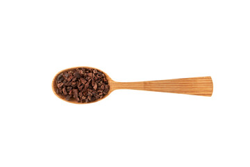 Cacao nibs in wooden spoon on white background. Sugar-free product. Natural antidepressant. Crushed cocoa beans of weak roasting. Good chocolate chip alternative.