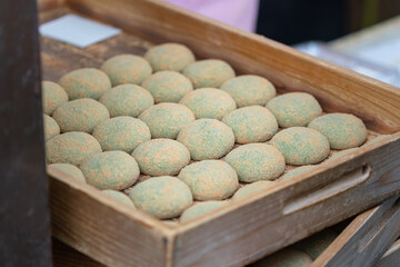 Green tea mochi with red bean rice ball, famous, sweet food of Nara, Japan. Food object photo, selective focus.