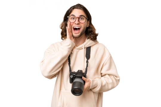 Young photographer man over isolated background with surprise and shocked facial expression