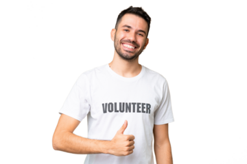 Young volunteer caucasian man over isolated chroma key background giving a thumbs up gesture