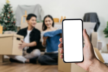 Man holding smartphone with blank screen, close-up of hands. Space for text.