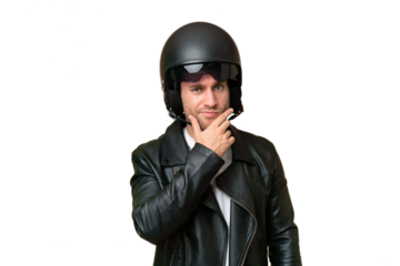 Young caucasian man with a motorcycle helmet isolated on green chroma background thinking