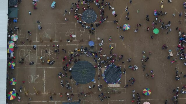 Flying above all Saint's Day In Sumpango during cloudy day, aerial