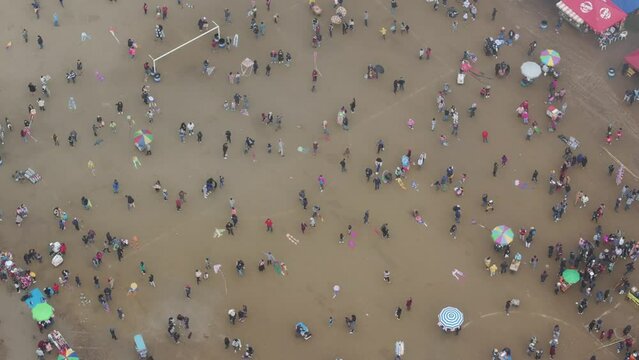 Aerial view of people flying small kites at Sumpango Kite Festival, guatemala