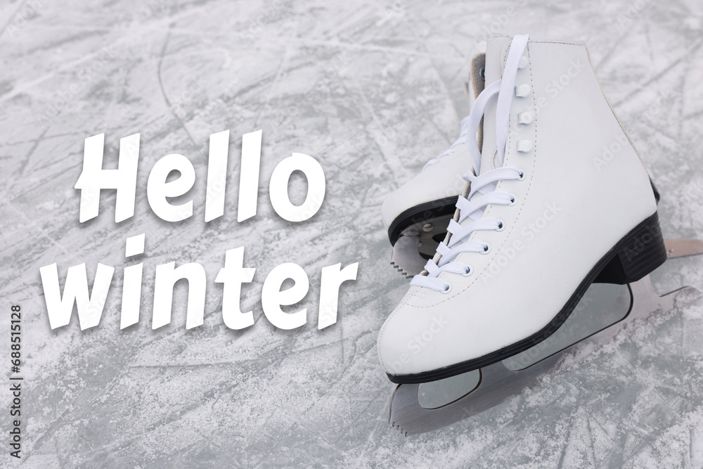 Poster Hello winter. Pair of figure skates on ice