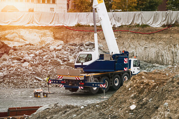 Close-up of big excavator on the urban construction site. Modern construction machinery at a...