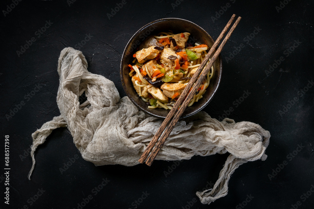 Wall mural fried noodles with chicken and vegetables.