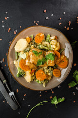 Fried chicken fillet with vegetables.
