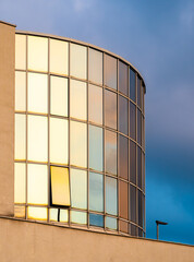 Architectural background - reflections of the evening sky in the glass of an office building