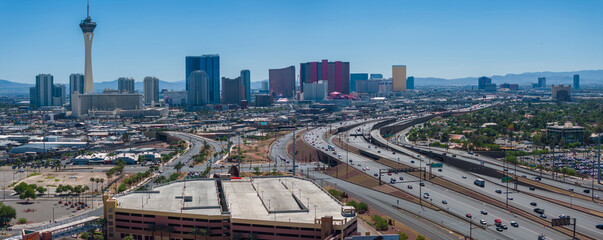 Elevated view of Las Vegas skyline featuring the Stratosphere Tower, high-rises with glass facades,...