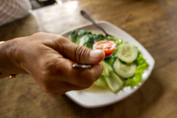 Stir fry Chinese cabbage. Green mustard served with cucumber slice on plate