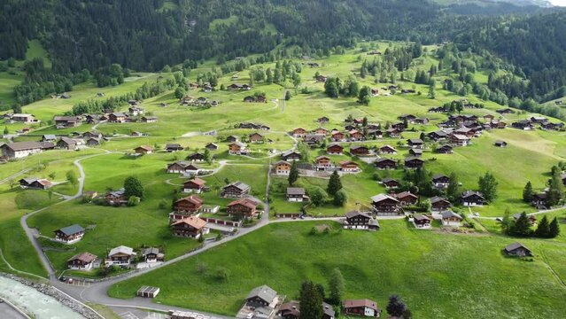Enchanting Grindelwald, Switzerland: Awe-Inspiring 4K Drone Footage of Majestic Swiss Alps and Traditional Architecture; Perfect for Alpine Escapes and Travel Blogs