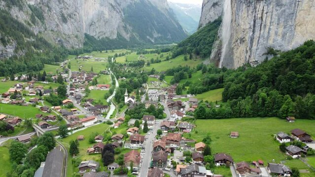 Alpine Elegance: A Cinematic Journey Through Lauterbrunnen, Switzerland; 4K Drone Captures Traditional Architecture, Staubbach Falls, and Tranquil Mountain Views. Inspiration for Lord of the Rings.