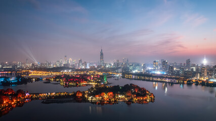 Fototapeta na wymiar Aerial photography of the night view of the city by Xuanwu Lake in Nanjing