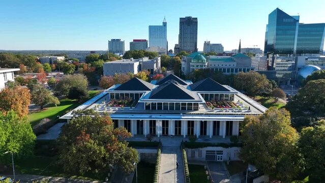 North Carolina legislative building and downtown Raleigh skyline with capitol complex. Aerial descending shot.