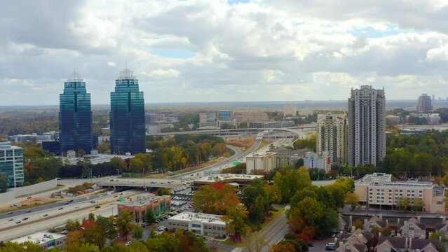 Aerial shot of the King and Queen towers in Atlanta with highway and traffic