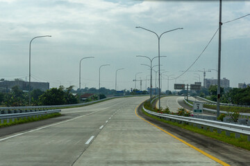 Fototapeta na wymiar view of Jalan Tol Trans Sumatera (Trans Sumatera Toll Road) in Medan, North Sumatera.