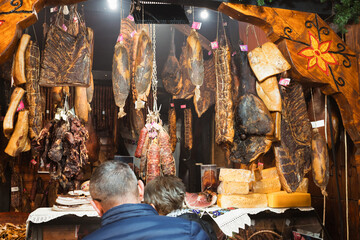 Butcher's market stall with grilled, smoked and cured meat, ham, sausages in Timisoara Romania