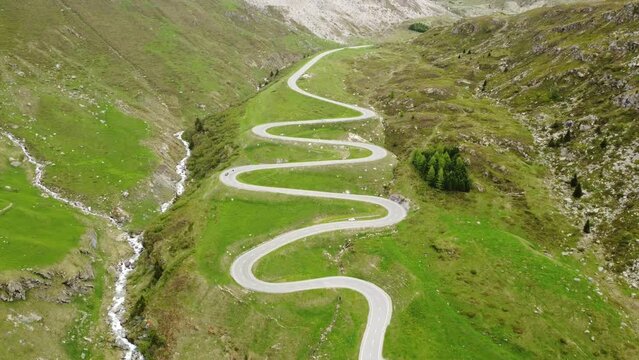 Alpine Majesty: Aerial 4K Drone Footage of Julier Pass Serpentine Road, Switzerland; Scenic Route to St Moritz with Breathtaking Mountain Views