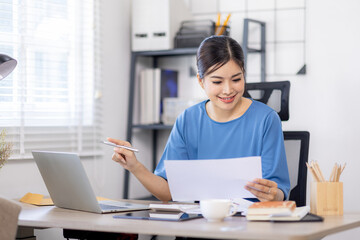 Asian Business woman work in home. concept of tax, report, accounting, statistics, and analytical research.