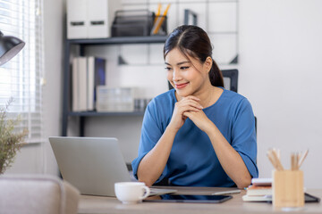 Asian Business woman work in home. concept of tax, report, accounting, statistics, and analytical research.