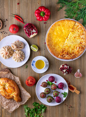 Uzbek and Central Asia cuisine concept. Assorted Uzbek food pilaf samsa lagman manti shurpa Uzbek restaurant concept Uzbek food. Food recipe background