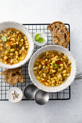Warming white bean soup with mushrooms