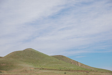 Obraz premium Beautiful landscape of mountains, rocks, green forest and blue sky